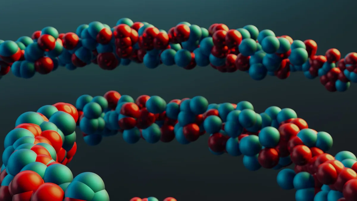 Bilgisayar ekranında renkli ve karmaşık protein üç boyutlu yapı simülasyonu görülüyor