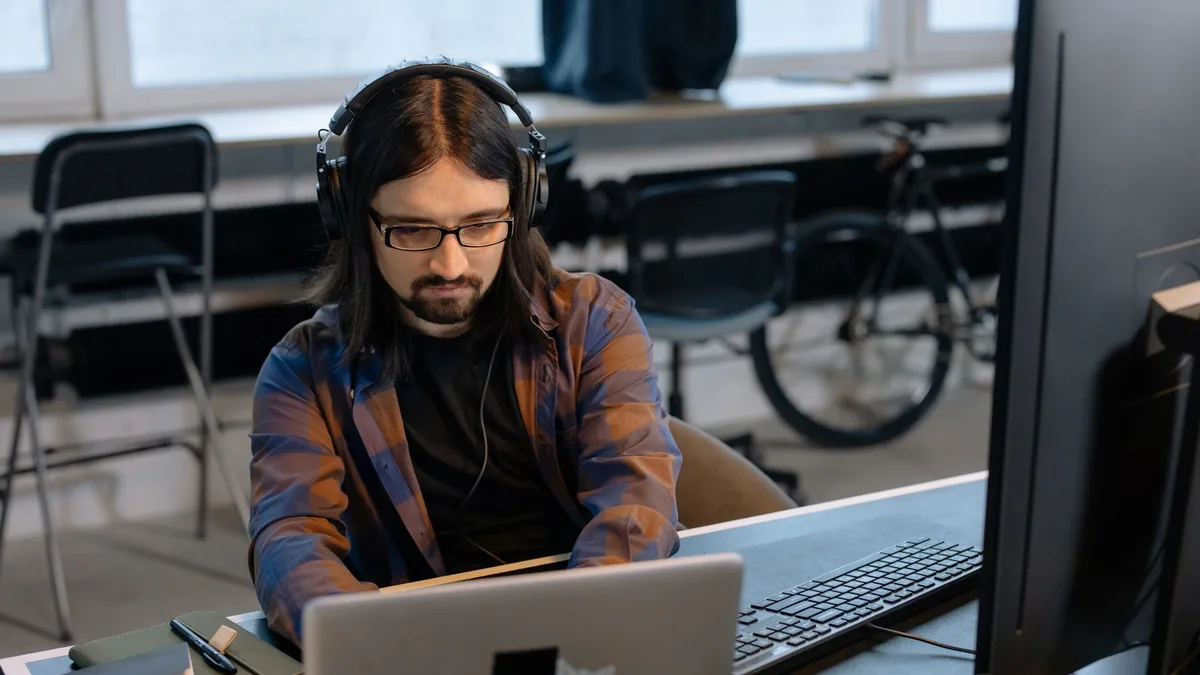 software developer working on laptop